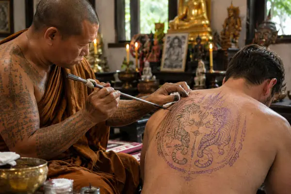 Monk making a Sak Yant Tattoo